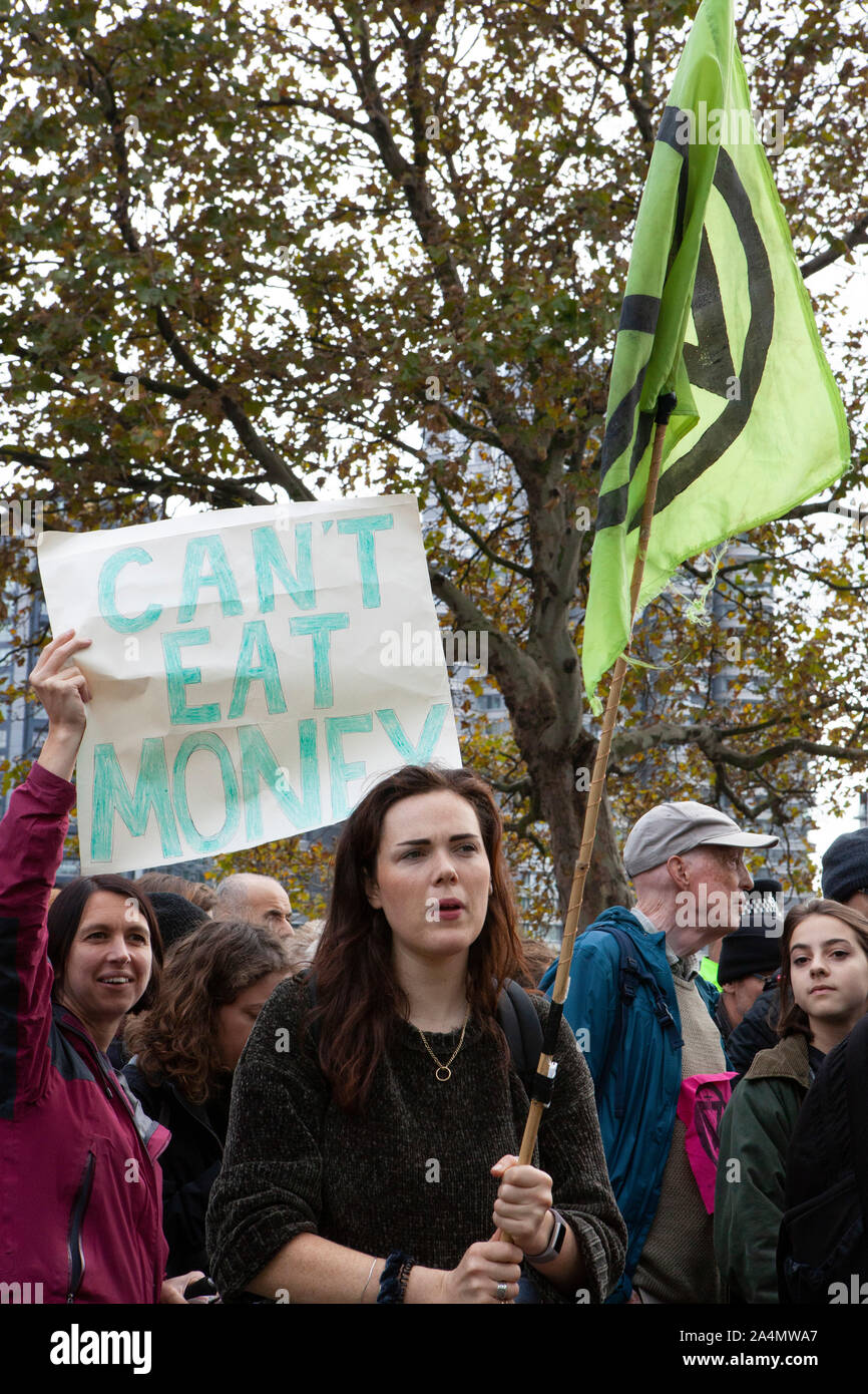 Extinction Rebellion activists defied a London-wide ban on public protests this morning to close off Millbank outside the offices of MI5. Protesting about the lack of food security possible if climate change isn't averted, they parked a caravan in the road and staged a sit in with singing and picnics. Police made numerous arrests. Stock Photo