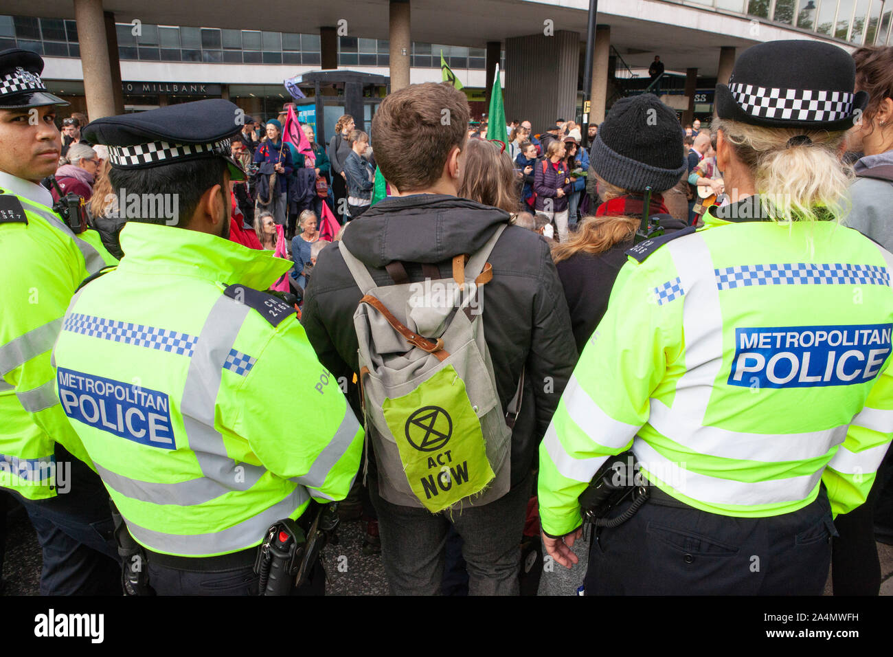 Extinction Rebellion activists defied a London-wide ban on public protests this morning to close off Millbank outside the offices of MI5. Protesting about the lack of food security possible if climate change isn't averted, they parked a caravan in the road and staged a sit in with singing and picnics. Police made numerous arrests. Stock Photo