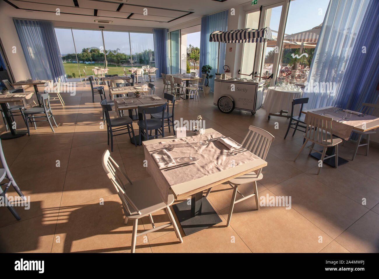 Tables set in a restaurant 2 Stock Photo - Alamy