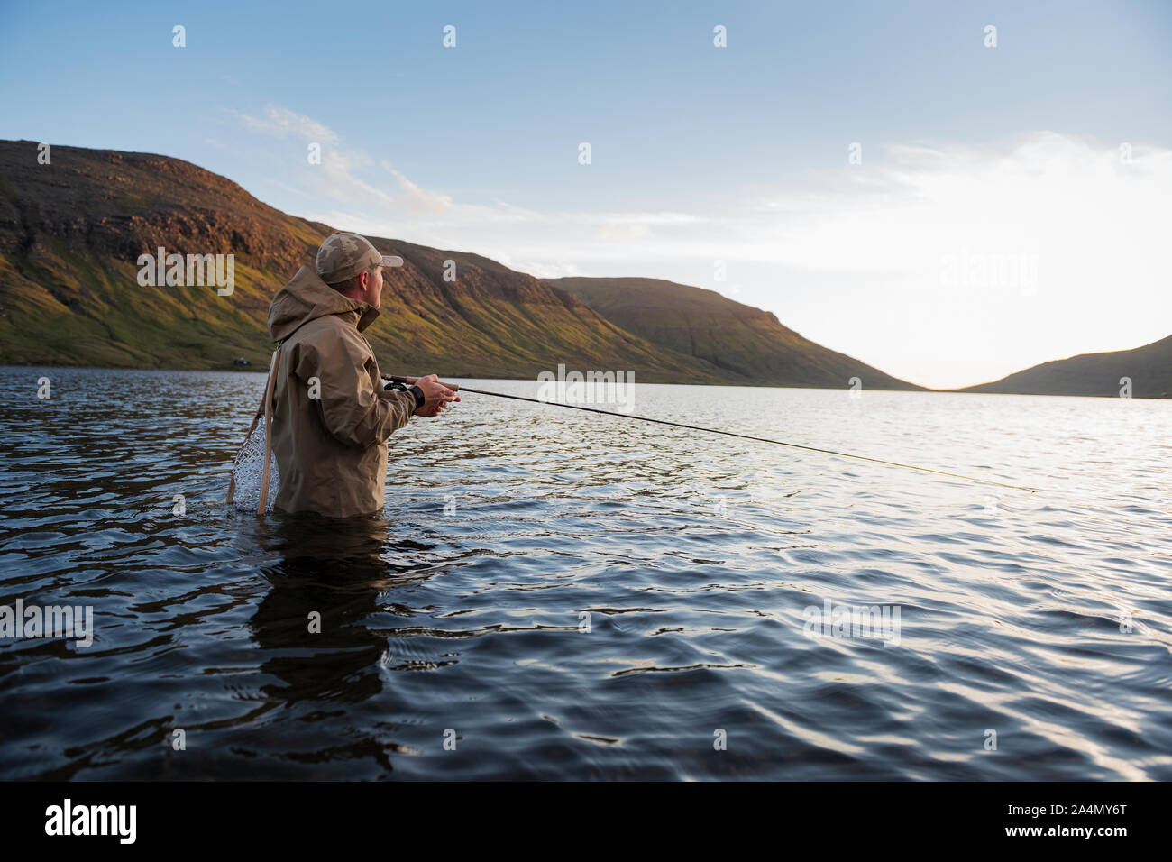 Man fishing in lake Stock Photo