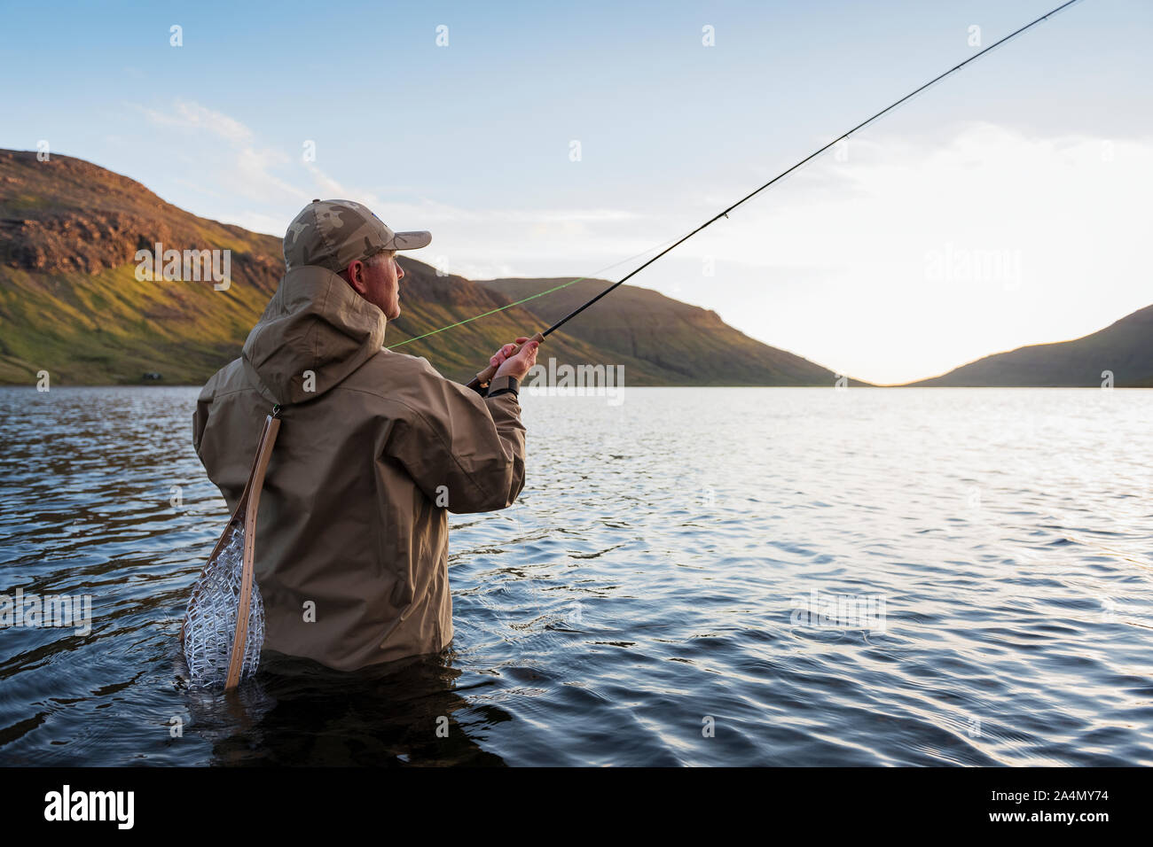 Man fishing in lake Stock Photo