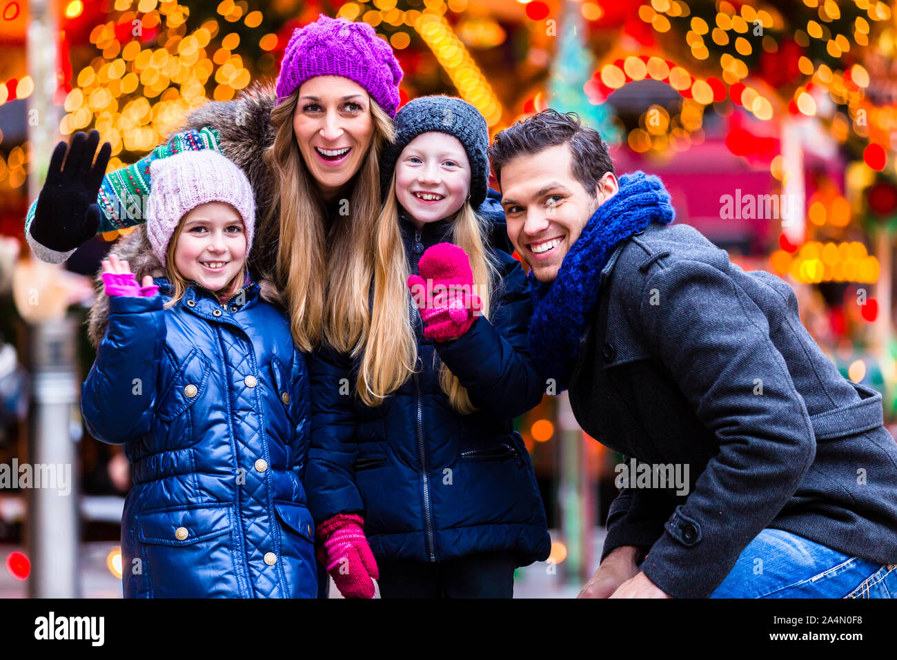 Family visiting traditional Christmas market Stock Photo Alamy