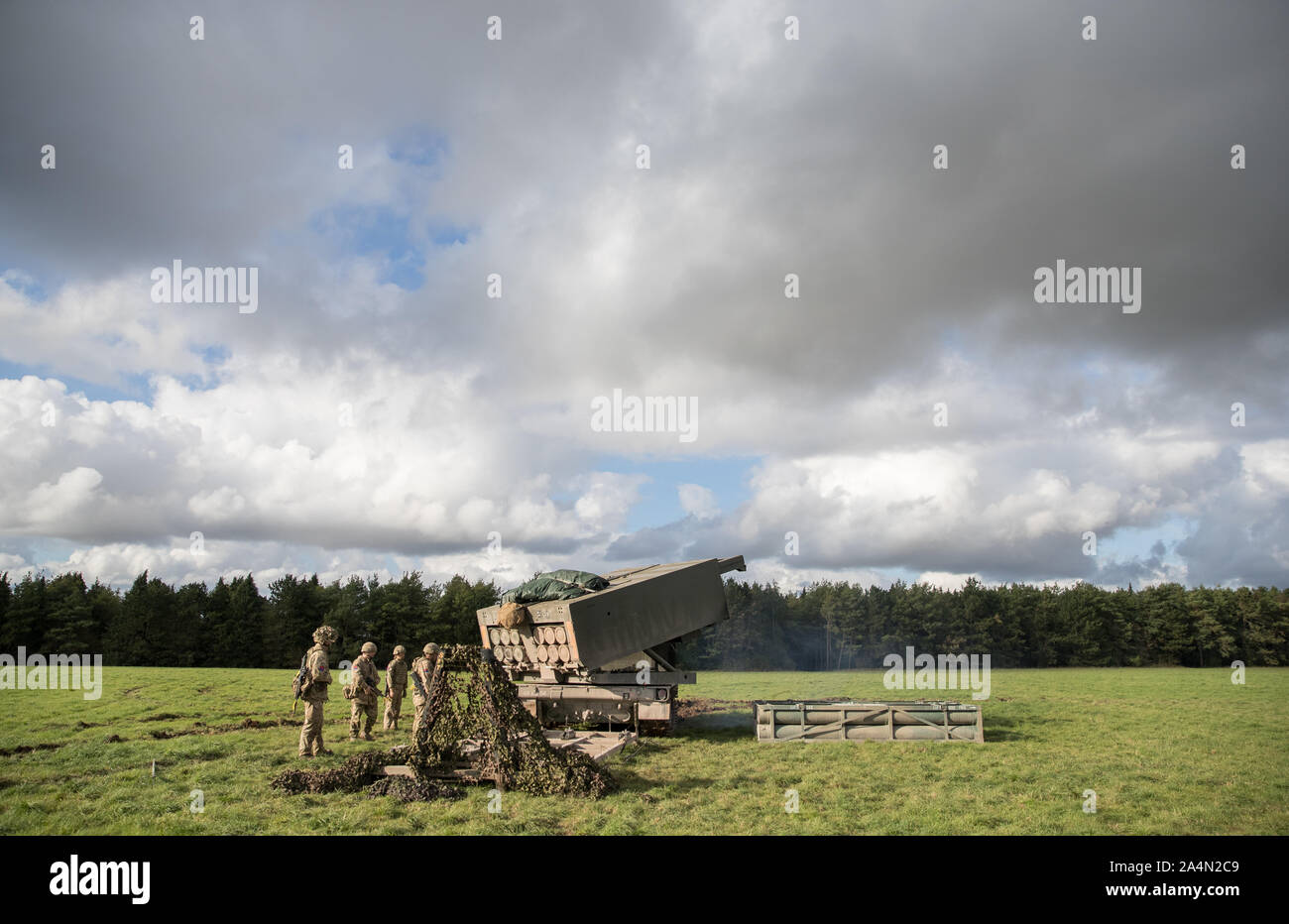 Members of 26 Regiment Royal Artillery position their Multi Launch Rocket System (MLRS) on Salisbury Plain, Wiltshire during exercise Congreve Spear. Stock Photo