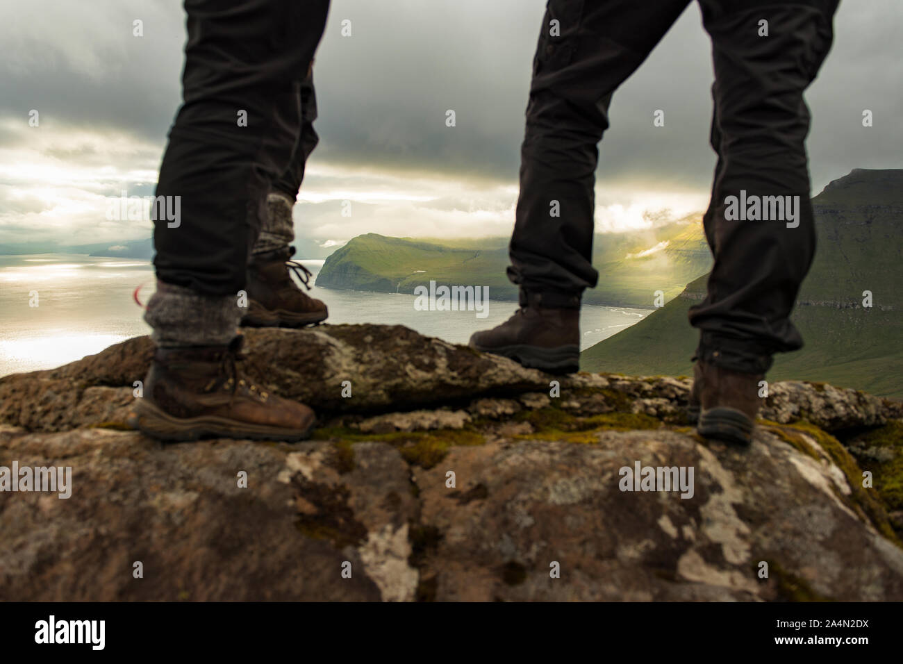 Two hikers standing on rocks hi-res stock photography and images - Alamy