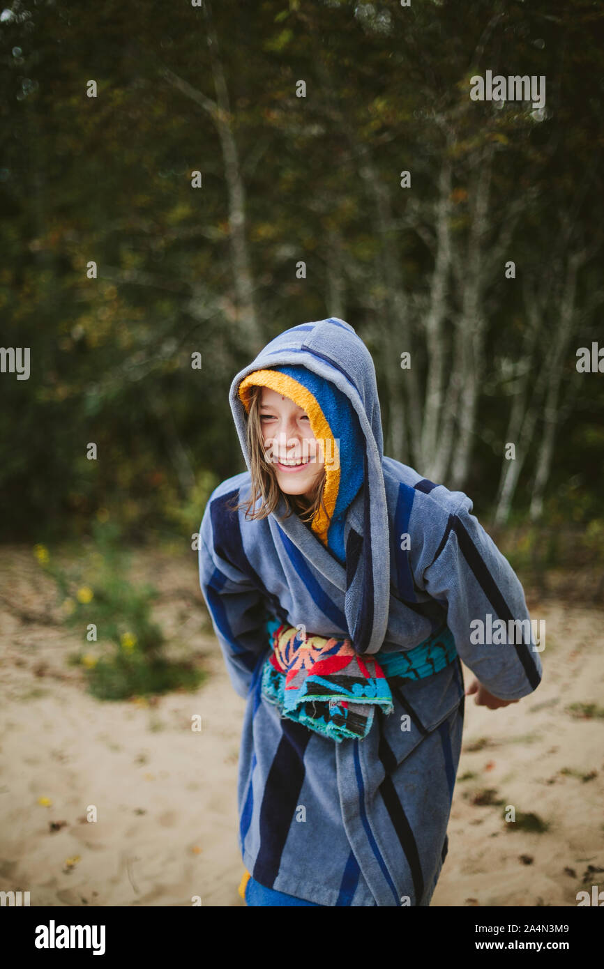 Happy boy wearing dressing gown Stock Photo