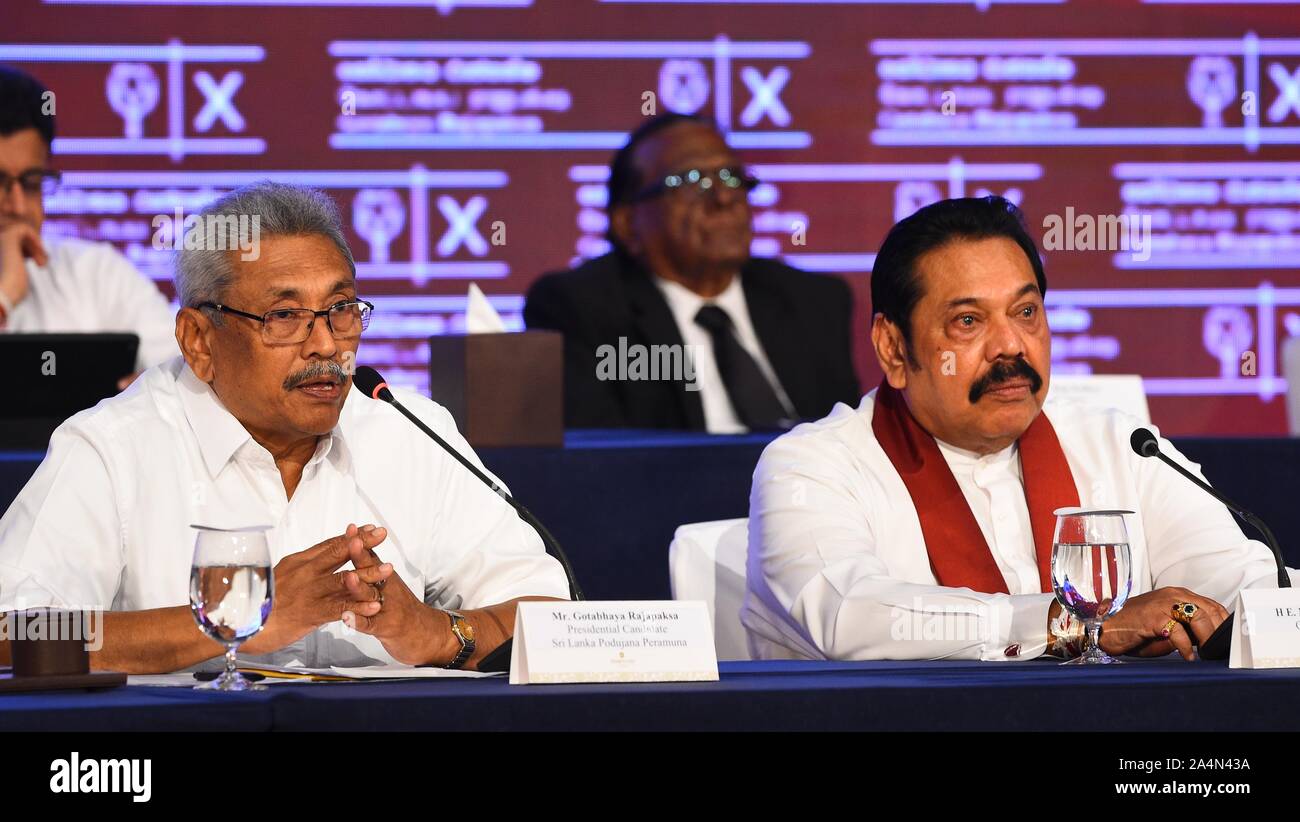 Colombo, Sri Lanka. 15th Oct, 2019. Gotabaya Rajapaksa (L), Sri Lanka's presidential candidate of the main opposition Sri Lanka Podujana Peramuna (SLPP), speaks to the press in Colombo, Sri Lanka, Oct. 15, 2019. Gotabaya Rajapaksa vowed on Tuesday to maintain a neutral foreign policy and friendly ties with all nations, if he wins the presidential election on Nov. 16. Credit: A.Hapuarchchi/Xinhua/Alamy Live News Stock Photo