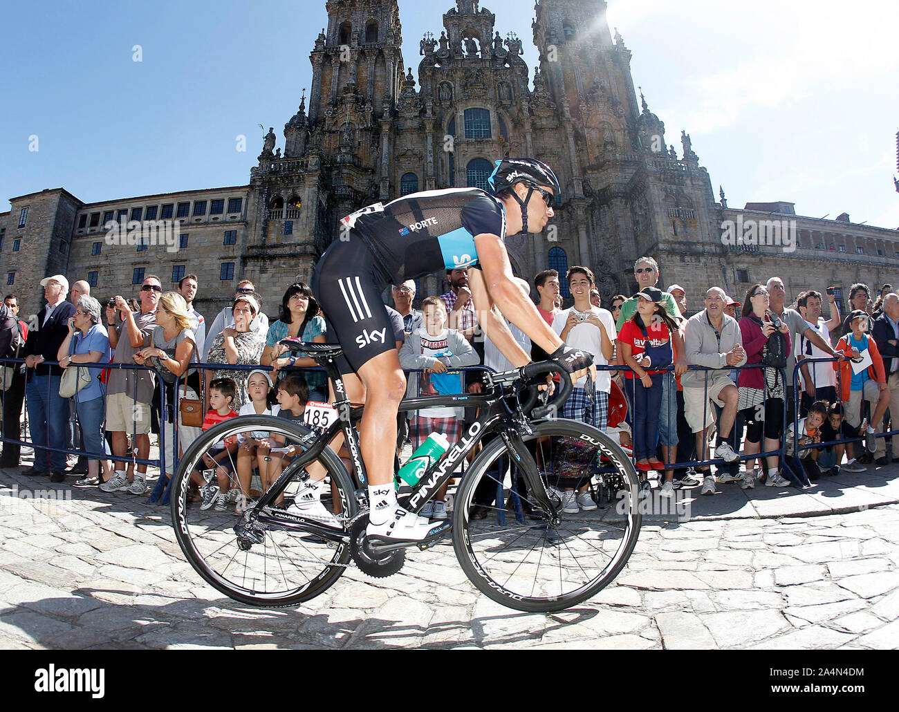 Richie Porte passes by the front of the Obradoiro of the Cathedral of Santiago de Compostela before the stage of La Vuelta 2012 between Santiago de Co Stock Photo