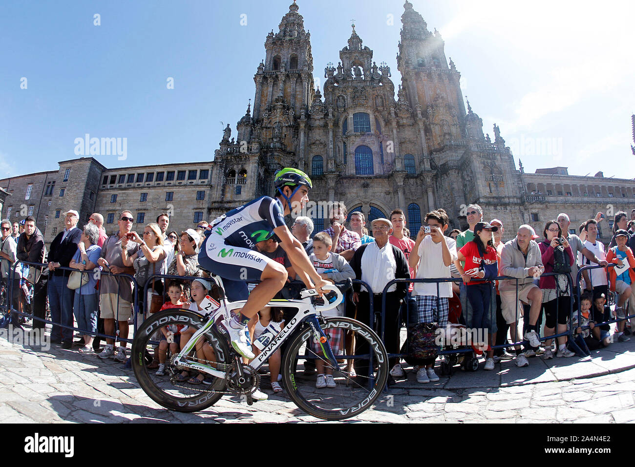 Jonathan Castroviejo passes by the front of the Obradoiro of the Cathedral of Santiago de Compostela before the stage of La Vuelta 2012 between Santia Stock Photo
