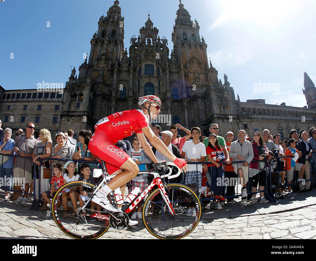 Florent Barle passes by the front of the Obradoiro of the Cathedral of Santiago de Compostela before the stage of La Vuelta 2012 between Santiago de C Stock Photo