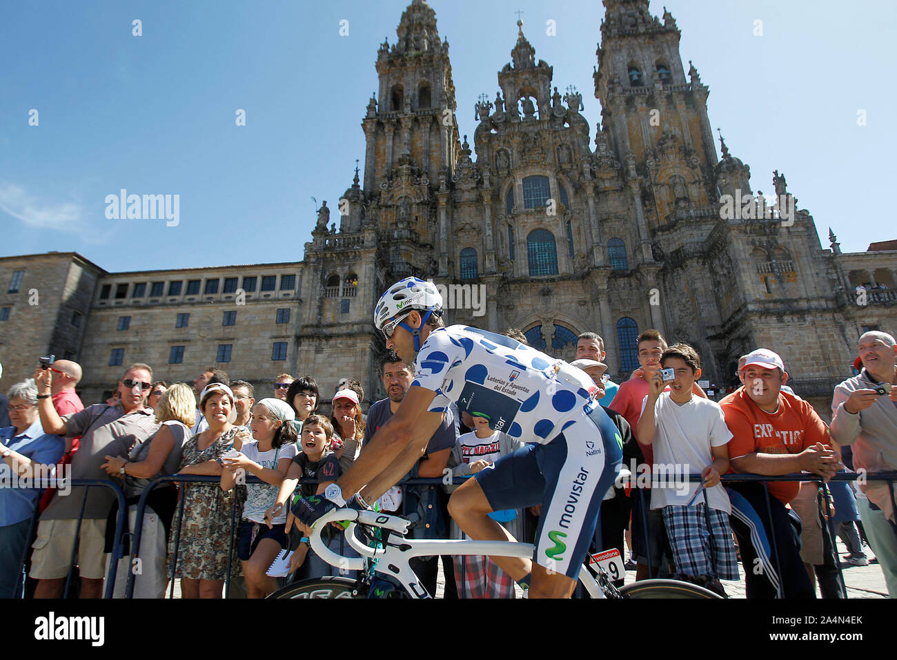 Alejandro Valverde passes by the front of the Obradoiro of the Cathedral of Santiago de Compostela before the stage of La Vuelta 2012 between Santiago Stock Photo