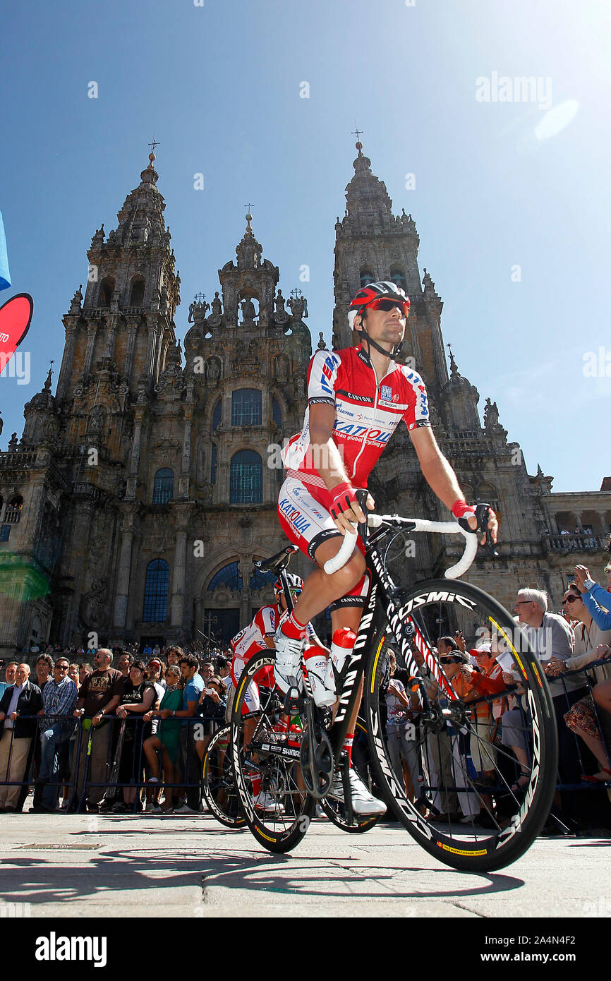 Joaquin Purito Rodriguez passes by the front of the Obradoiro of the Cathedral of Santiago de Compostela before the stage of La Vuelta 2012 between Sa Stock Photo
