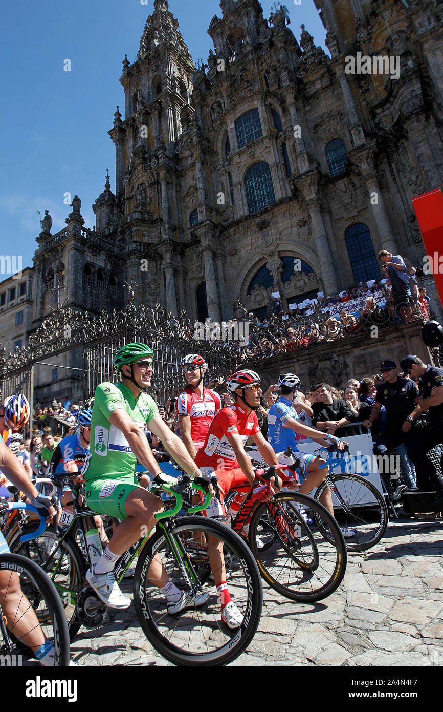 John Degenkolb and Joaquin Purito Rodriguez (r) passes by the front of the Obradoiro of the Cathedral of Santiago de Compostela before the stage of La Stock Photo
