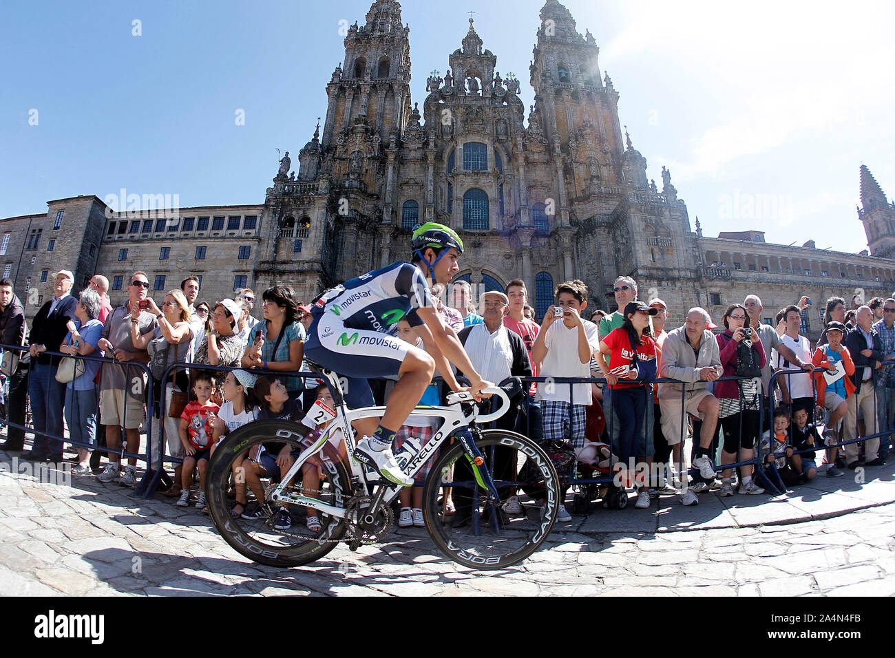 Jonathan Castroviejo passes by the front of the Obradoiro of the Cathedral of Santiago de Compostela before the stage of La Vuelta 2012 between Santia Stock Photo