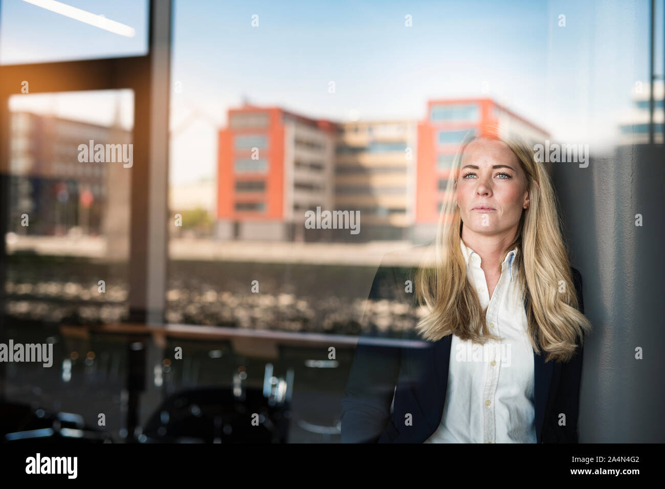 Businesswoman looking away Stock Photo - Alamy