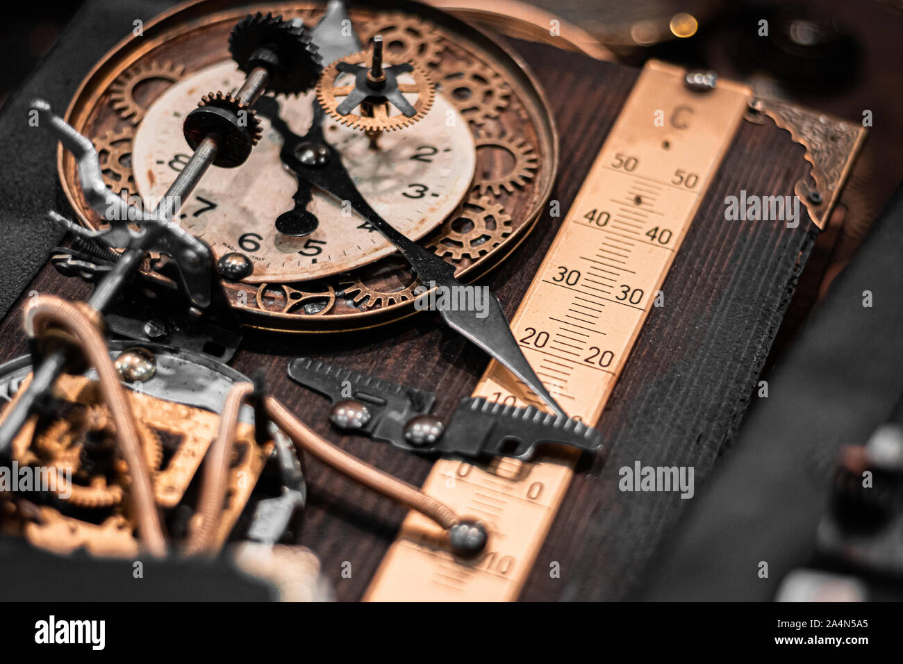 Steampunk Clockwork machinery and tools for time travelling. Hand made art, brass and golden details. Halloween theme, retro noir atmosphere. Stock Photo