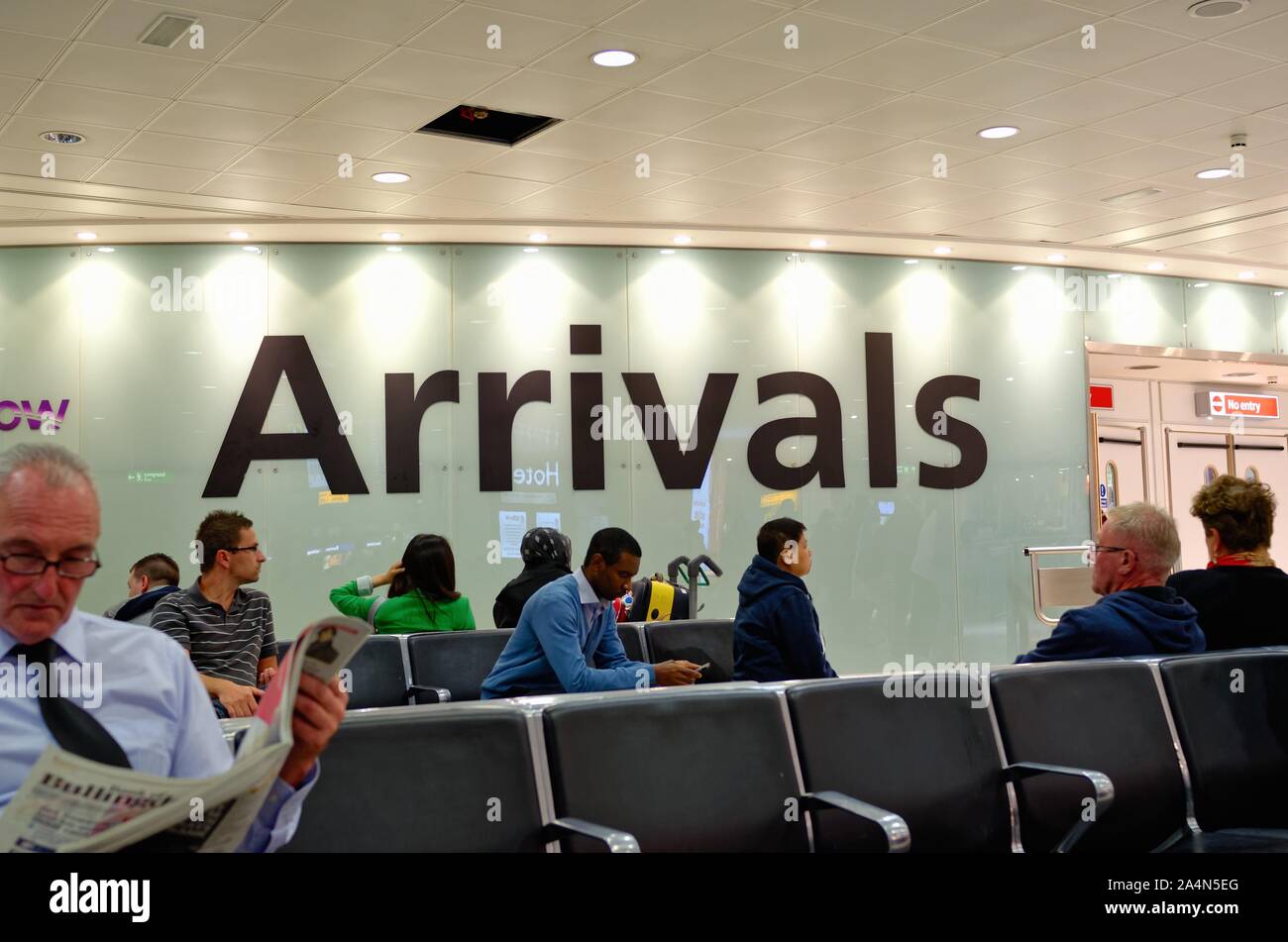 Large 'Arrivals' sign in Terminal Three arrival hall  at London Heathrow airport England UK Stock Photo