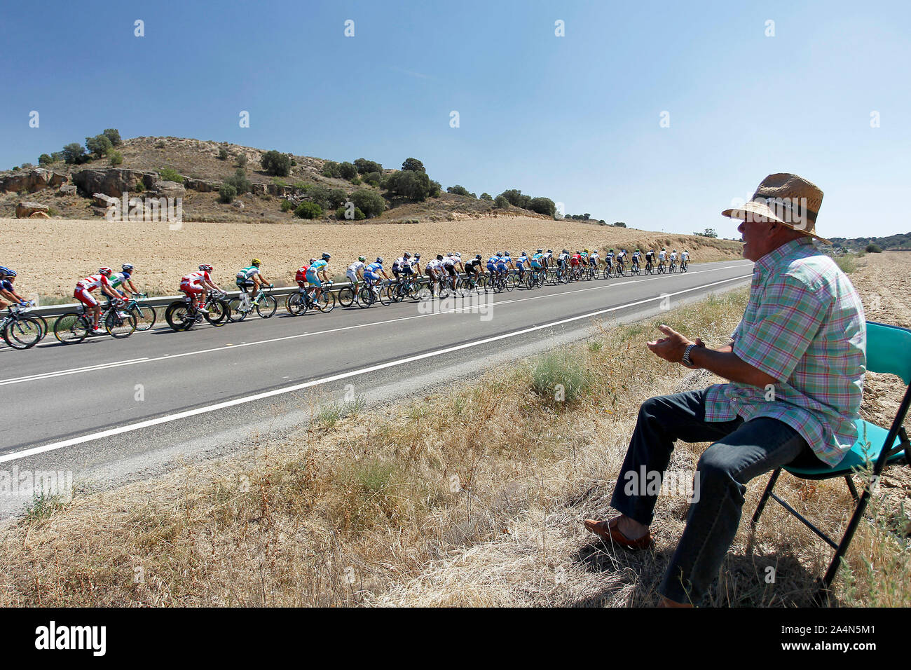 A fan of cycling greets riders in the peloton during the stage of La Vuelta 2012 between Huesca and Motorland Aragon (Alcaniz).August 24,2012. (ALTERP Stock Photo