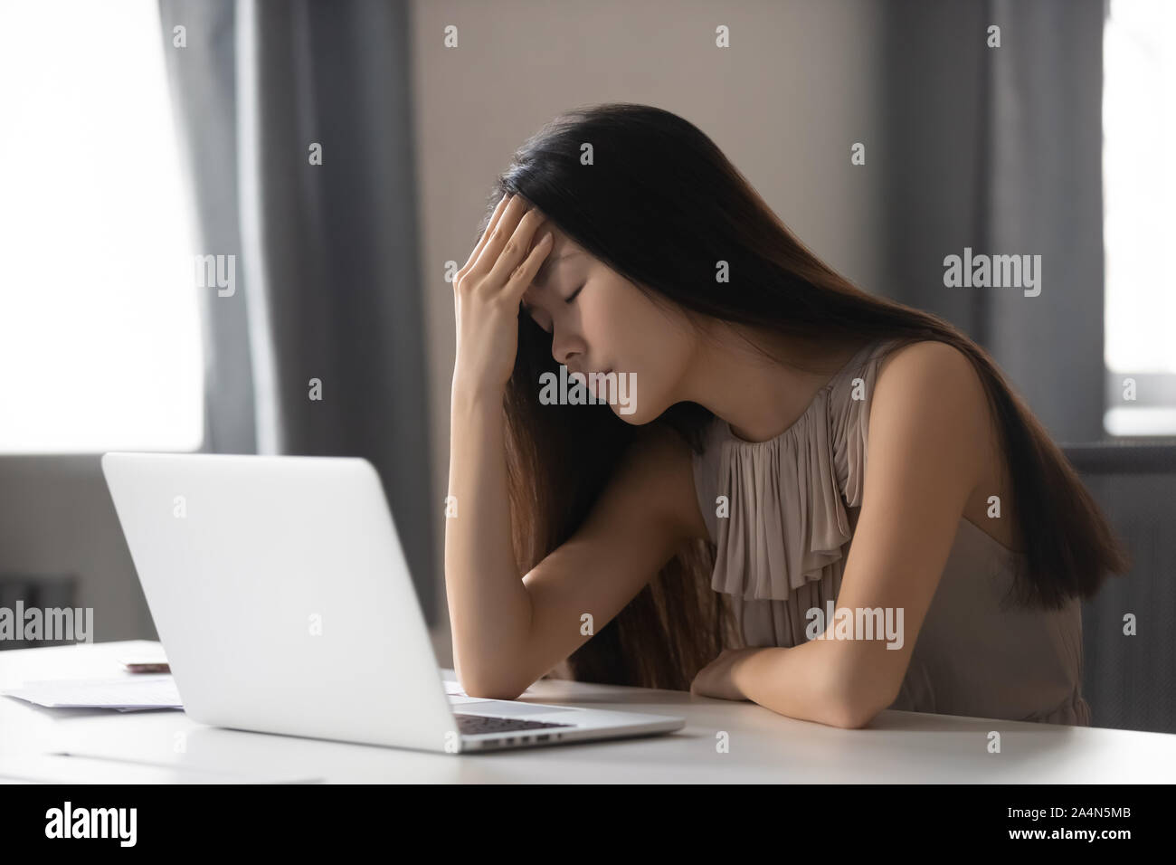 Laptop young asian woman headache hi-res stock photography and images ...