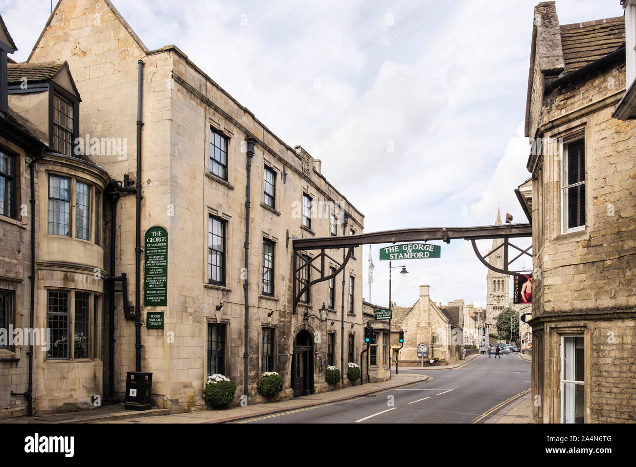 The George Hotel and sign across the main road. Stamford, Lincolnshire, England, UK, Britain Stock Photo