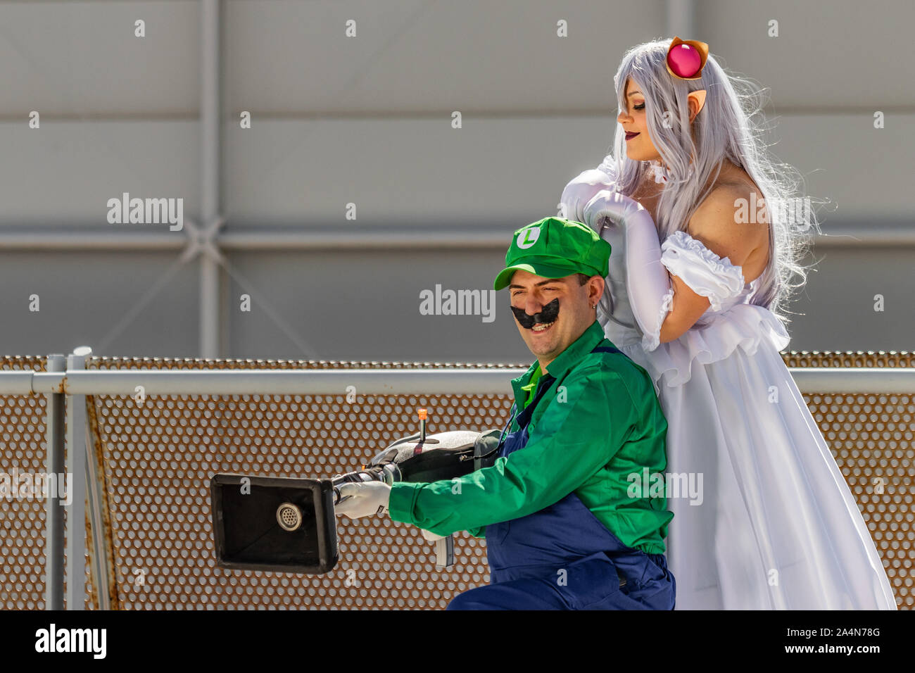 Rome, Italy, 5 April 2019, Comic and Cosplayer event called 'Romix'. Close ups and medium shots of 'Luigi and Princess' in daylight. Famous videogame Stock Photo