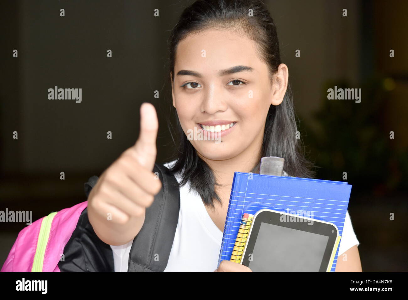 Cute Minority Female Student With Thumbs Up Stock Photo - Alamy