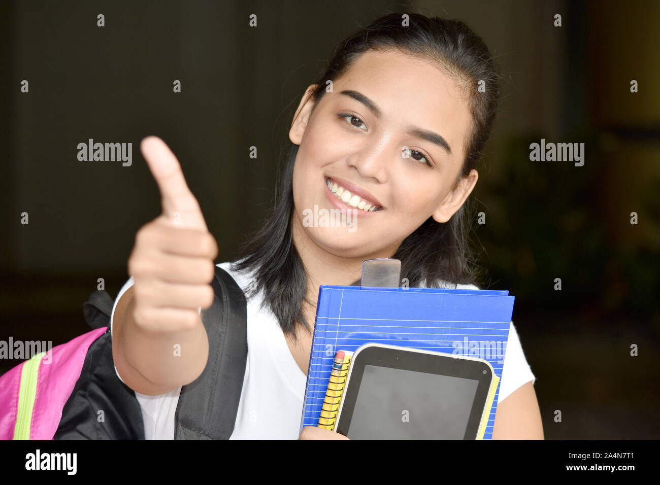 Girl Student With Thumbs Up Stock Photo - Alamy