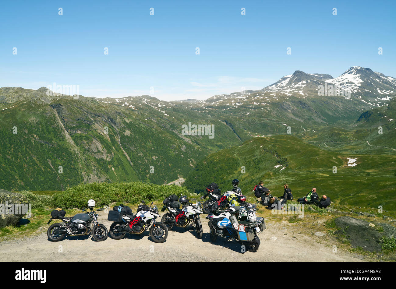 Bikers resting in mountains Stock Photo
