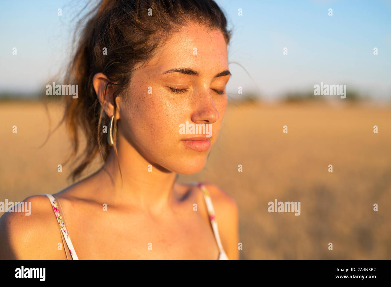 Young woman with eyes closed Stock Photo Alamy