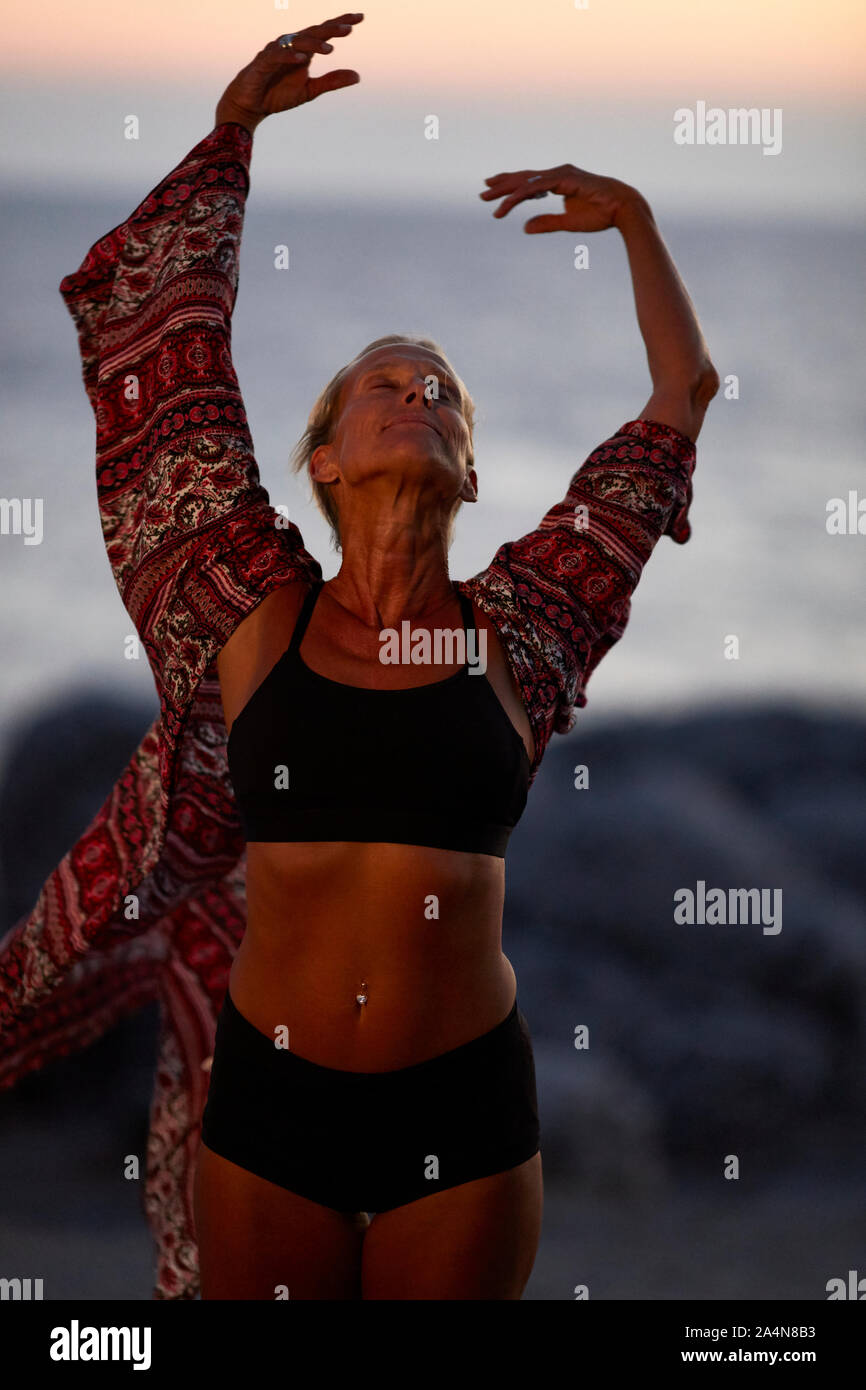 Mature woman beach arms hi-res stock photography and images - Alamy