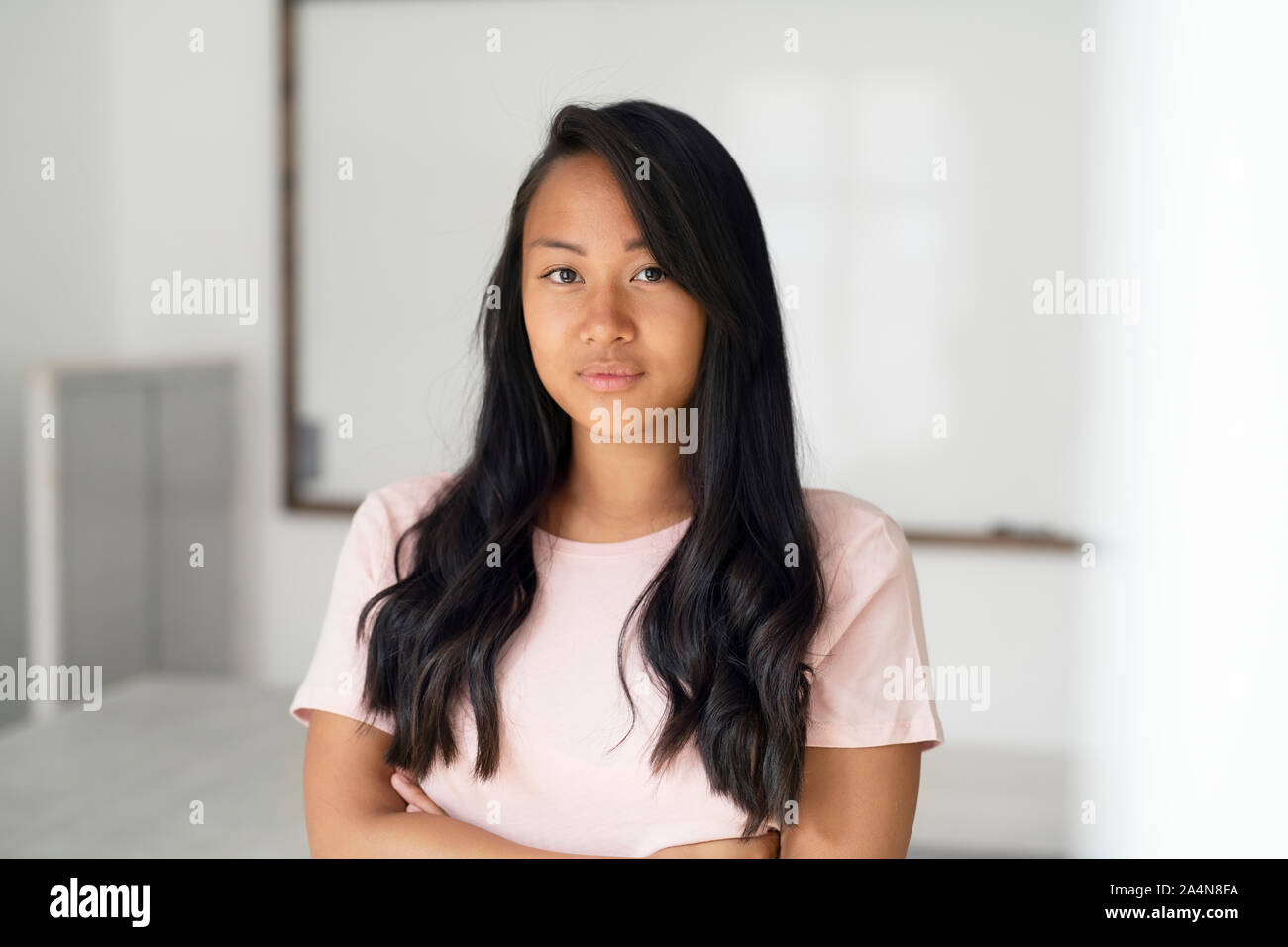Portrait of smiling young woman Stock Photo