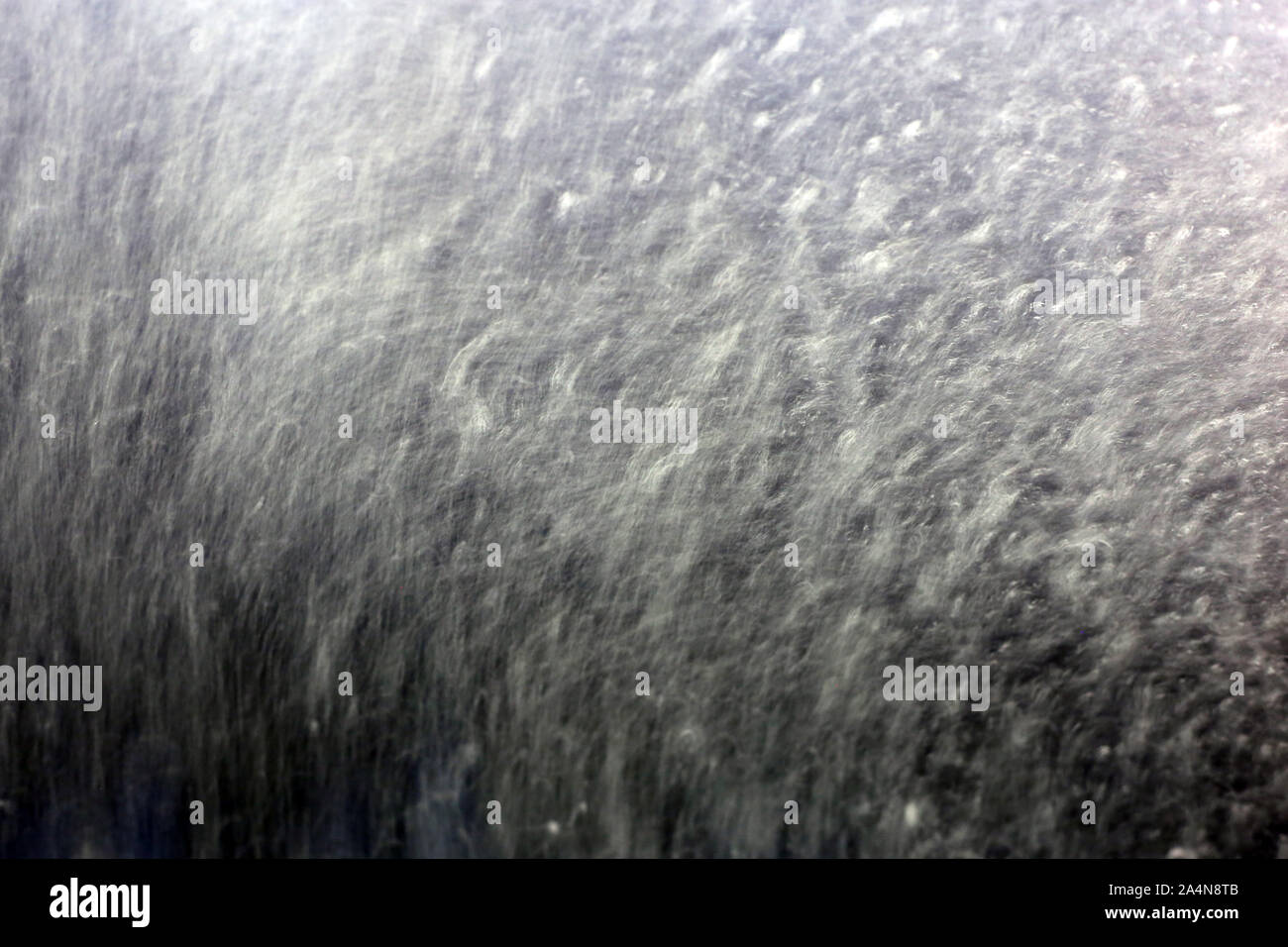Inside a car washing machine - view to the wet window is abstract ...