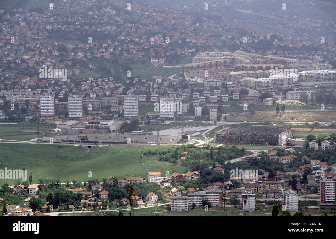 6th June 1993 During the Siege of Sarajevo: the view due east from Hum Hill. The Koševo City Stadium is almost centre-frame with the burned-out Juan Antonio Samaranch Olympic Hall (formerly known as the Zetra Olympic Hall) to the right. Stock Photo