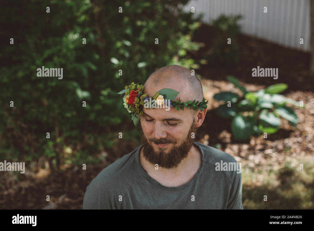 Bearded man wearing wreath Stock Photo