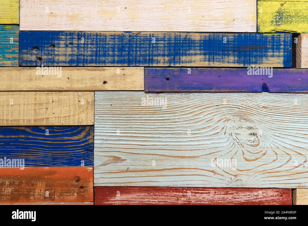 Horizontal painted multicolored wooden planks of wall in different colors. Surface texture, colorful background Stock Photo
