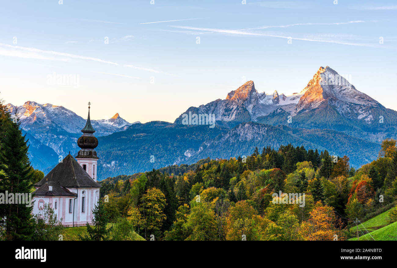 The small church of Maria Gern and Mount Watzmann in the first morning light Stock Photo