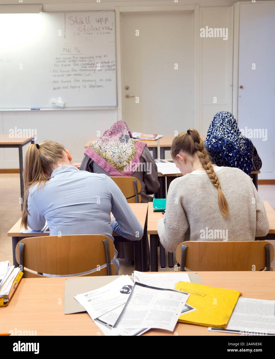 Pupils in school desks in a classroom.Photo Jeppe Gustafsson Stock Photo