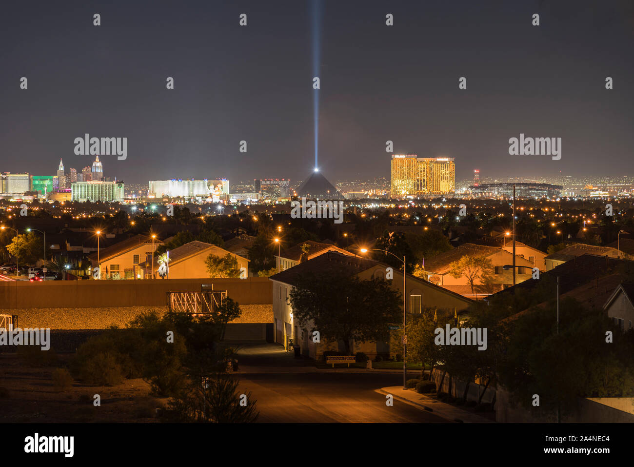 Las Vegas, Nevada, USA -  October 7, 2019:  Night view of bright resort towers and quiet residential homes. Stock Photo