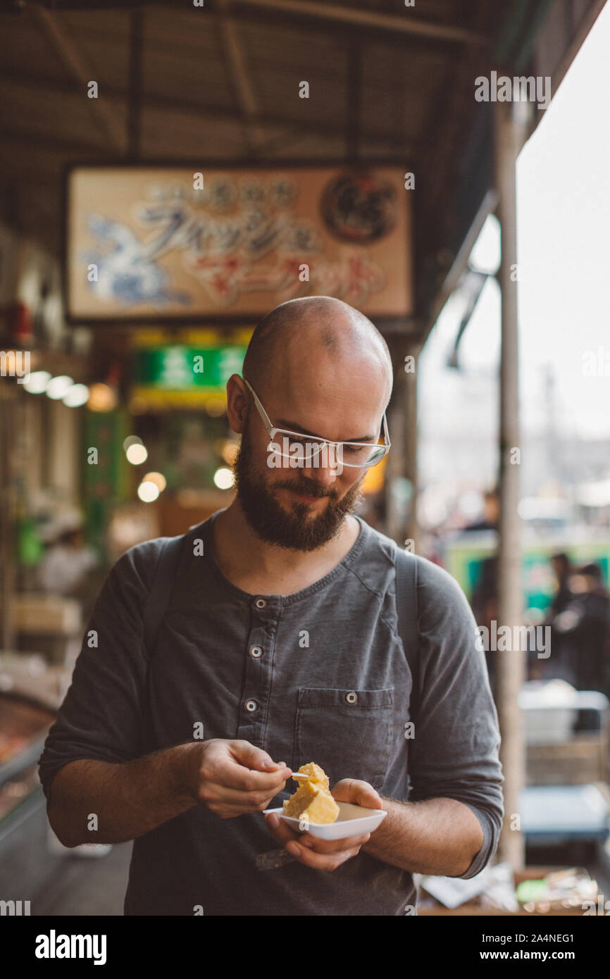 Man eating tofu Stock Photo - Alamy