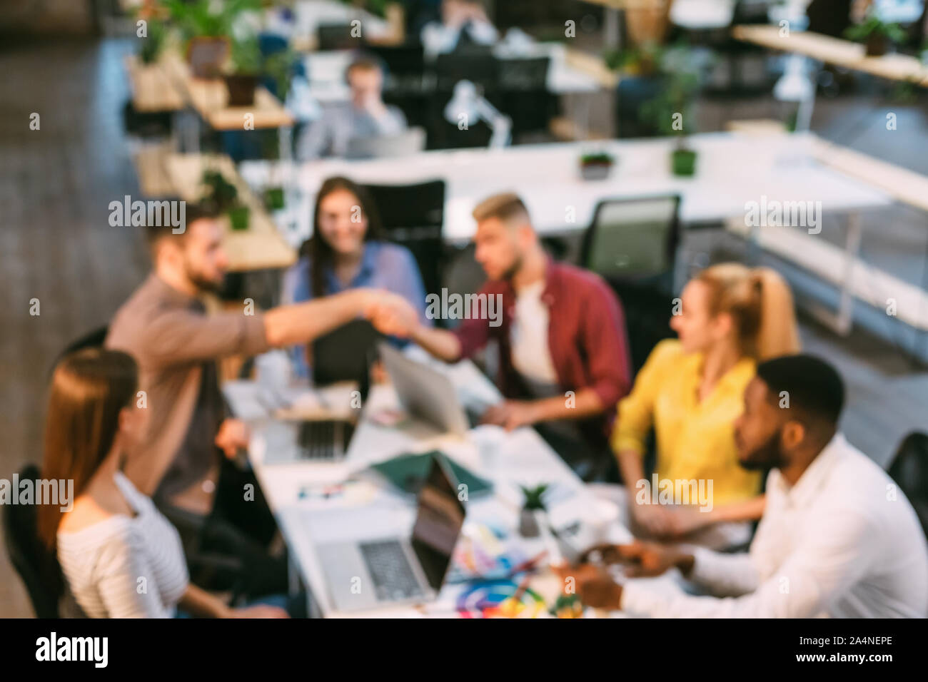 Creative colleagues working at desk in office Stock Photo