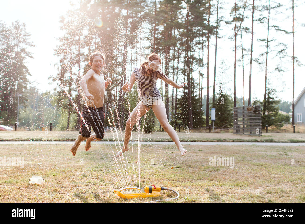 Cheerful kids playing with water Stock Photo
