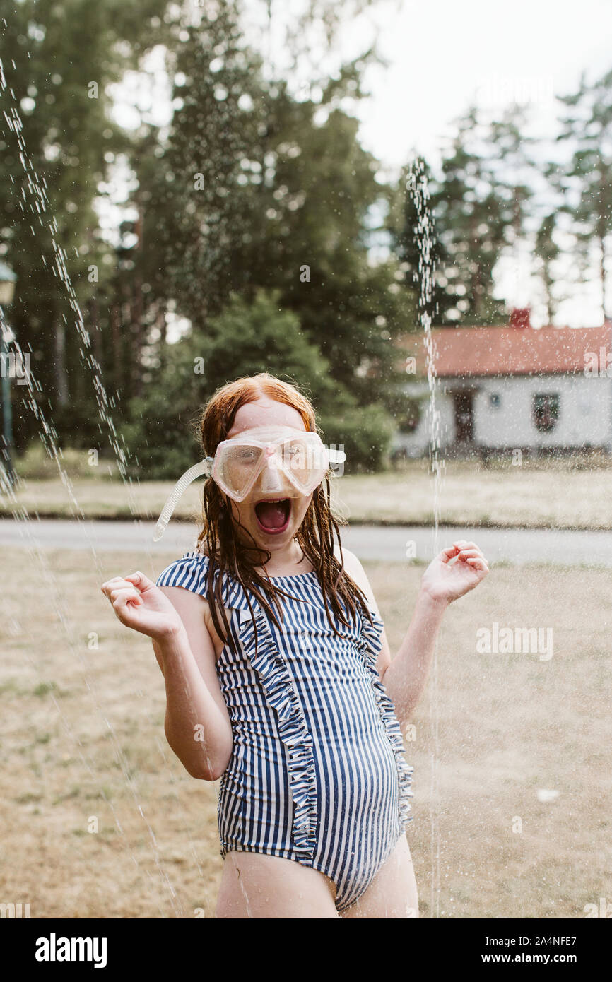 Cheerful girl wearing snorkel mask Stock Photo