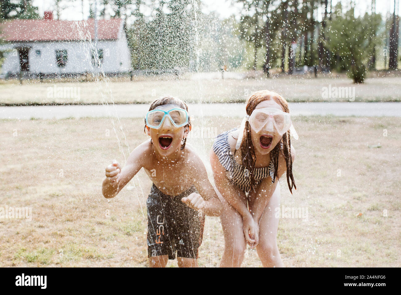 Cheerful kids wearing snorkel masks Stock Photo