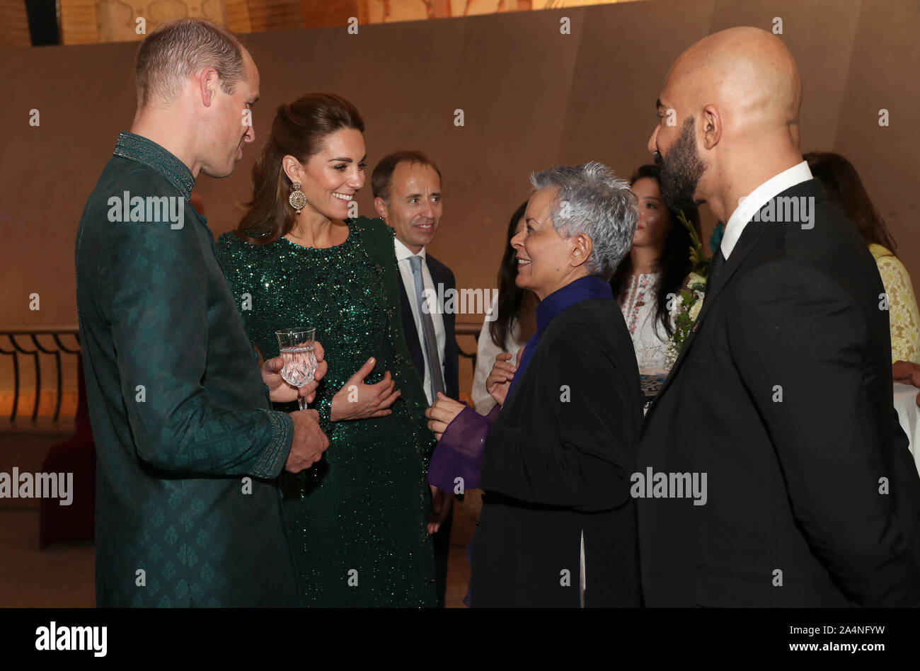 The Duke and Duchess of Cambridge speak with a guest as they attend a  reception hosted by the British High Commissioner to Pakistan Thomas Drew  CMG at the National Monument in Islamabad