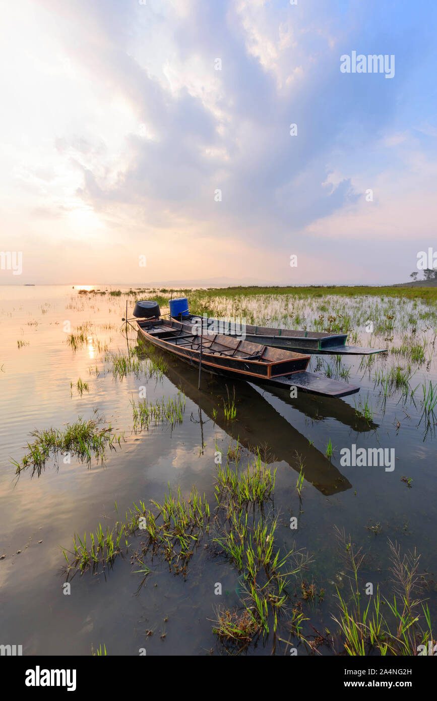 boat at the lake in sunset time Stock Photo - Alamy