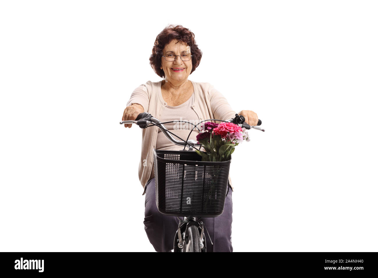Elderly lady riding a bicycle isolated on white background Stock Photo