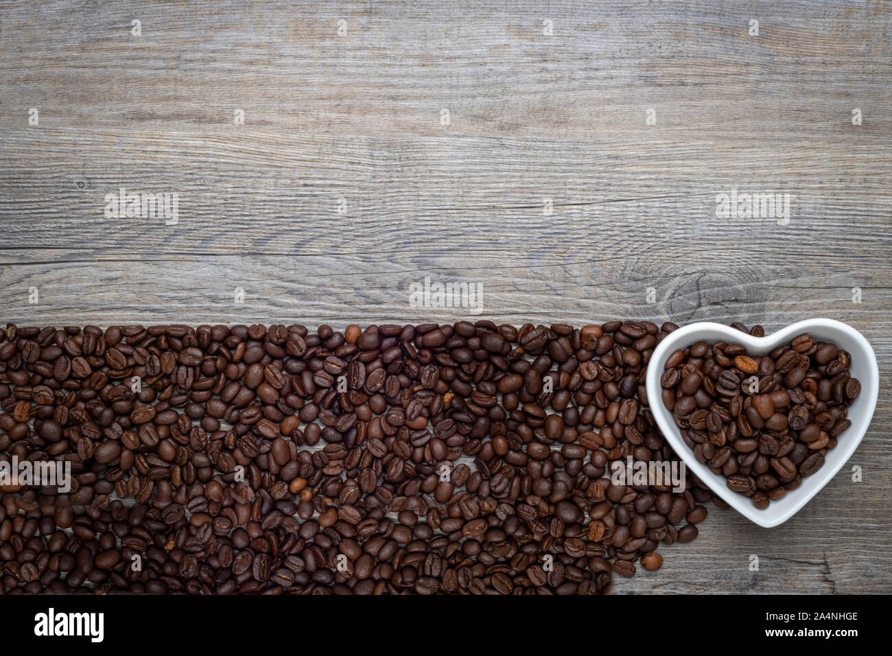 heart shaped bowl with coffee beans, concept. Stock Photo