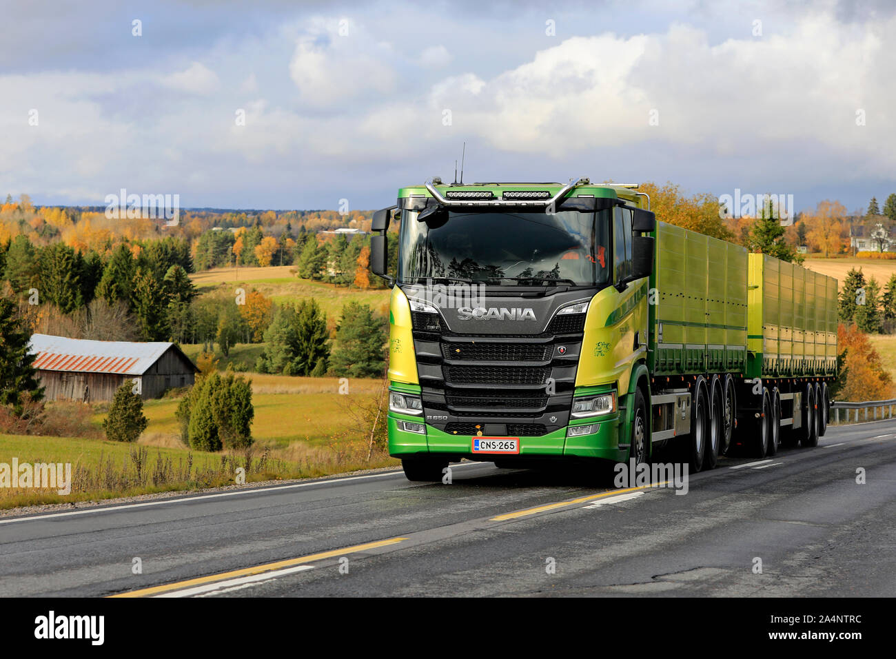 New, green Scania R650 truck of Kuljetus Saarinen Oy in seasonal sugar beet haul on scenic autumnal road in Salo, Finland. October 12, 2019. Stock Photo