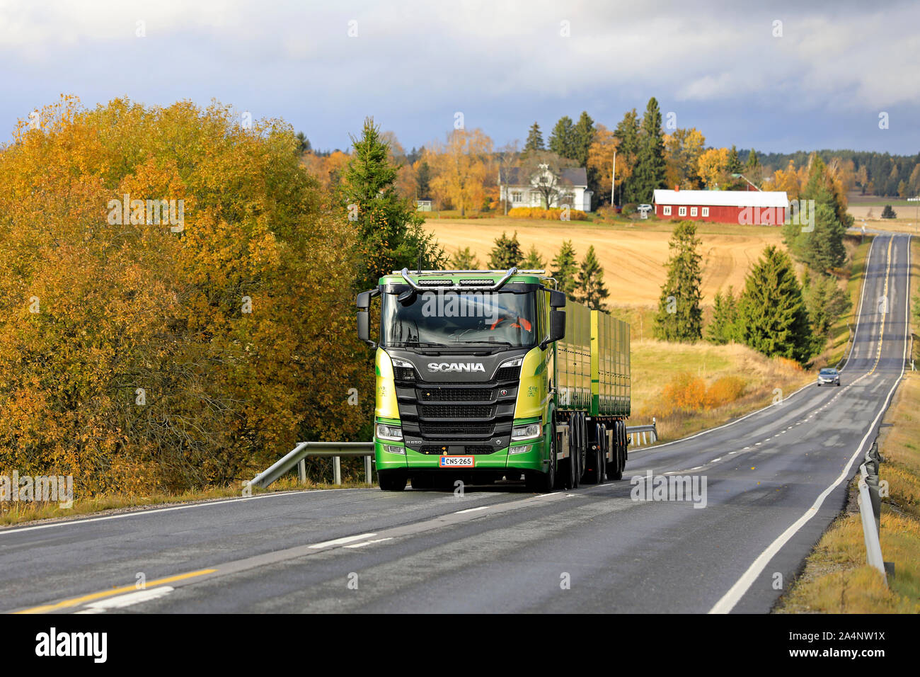 New, green Scania R650 truck of Kuljetus Saarinen Oy in seasonal sugar beet haul on scenic autumnal highway in Salo, Finland. October 12, 2019. Stock Photo