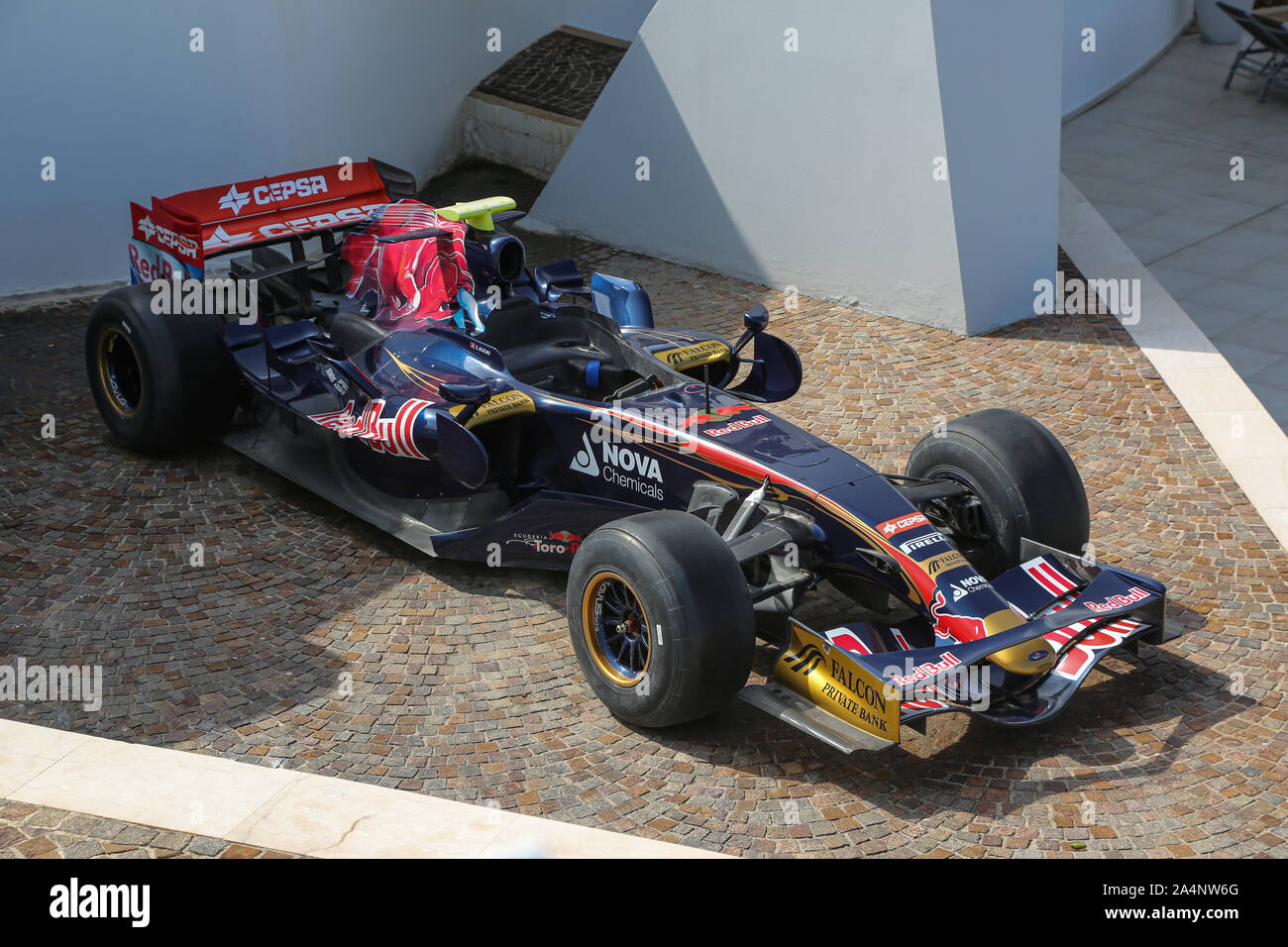 A Toro Rosso STR2B Formula One car sits outside the Cafe Del Mar Malta and the Malta National Aquarium in St Paul's Bay on the island of Malta Stock Photo