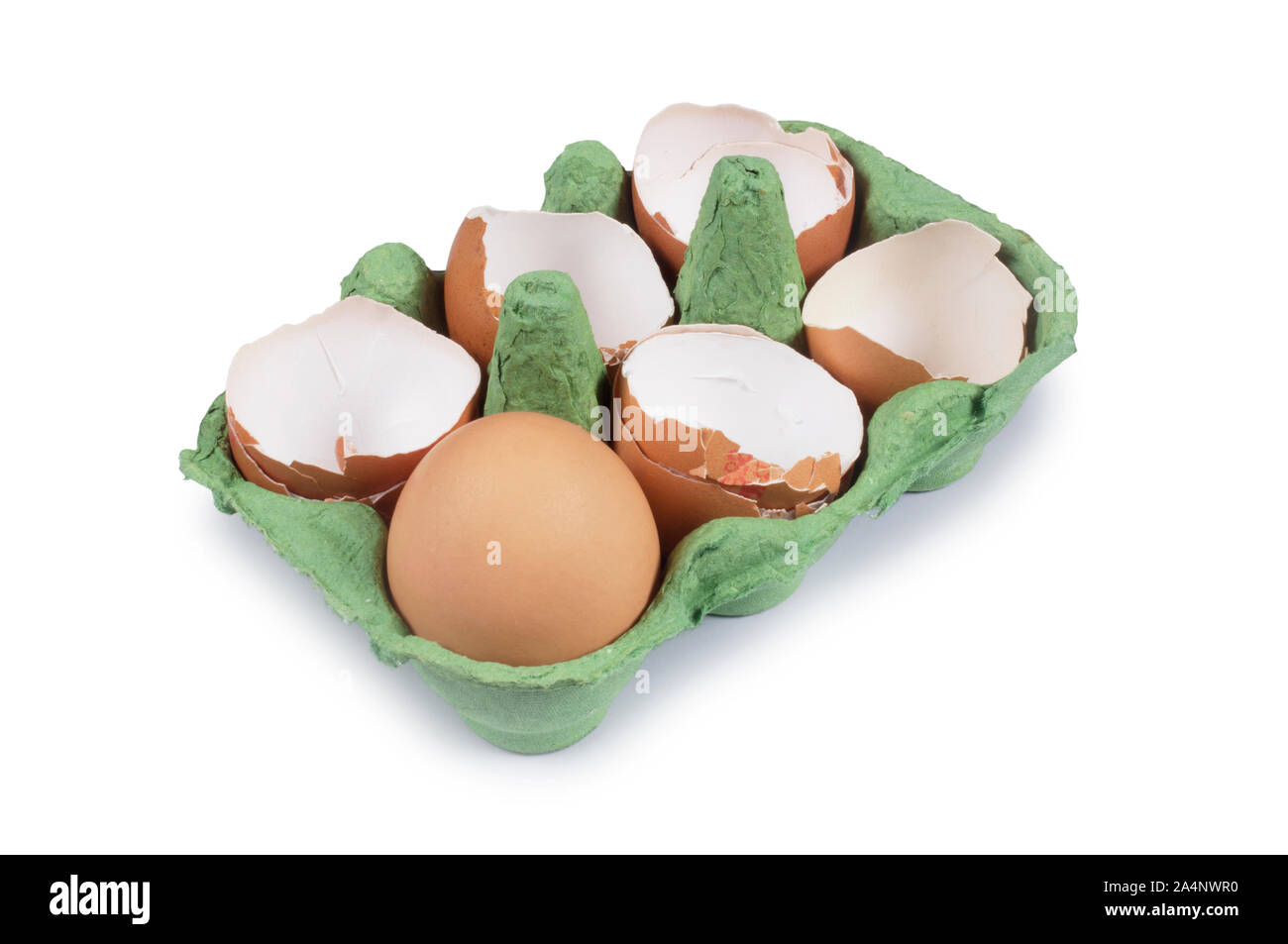 Studio shot of cracked egg shells in an egg box isolated on white 